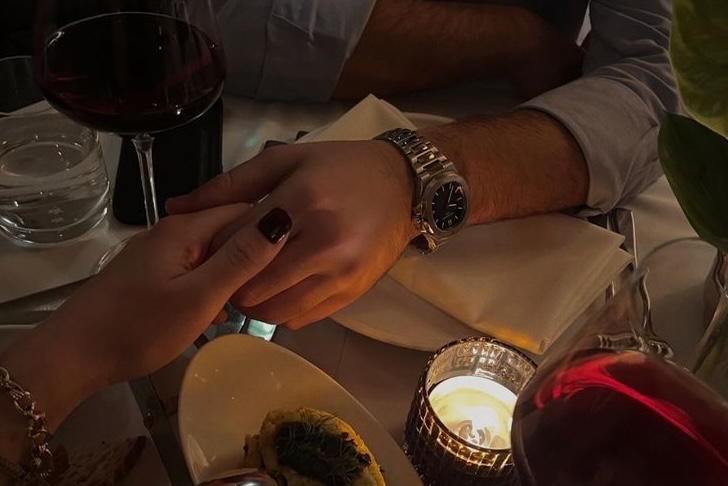 Happy couple sharing a joyful moment in a field of wildflowers